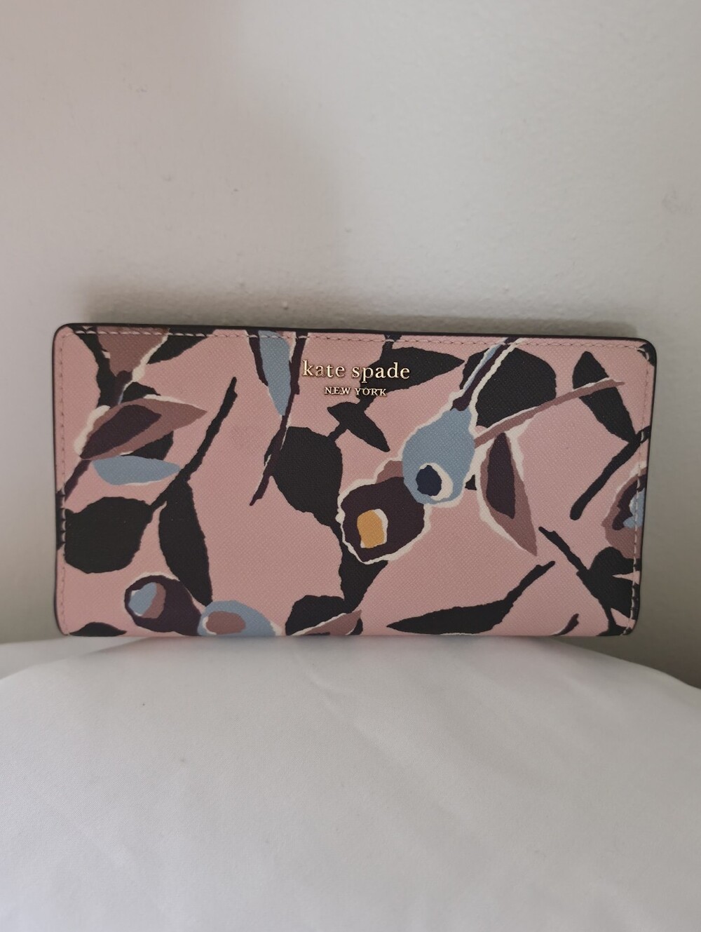 Pink floral Kate Spade New York Cameron Paper Rose wallet.
